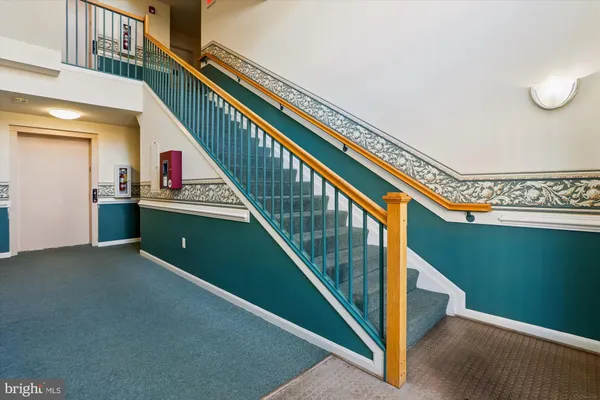 a view of a hallway with closet area
