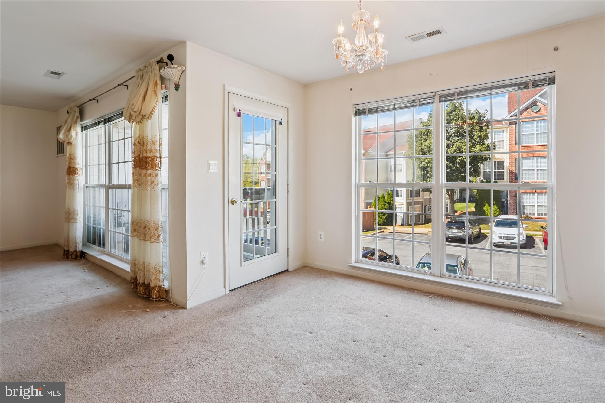 2500 Coleridge Drive, Unit 2A Frederick, MD 21702 - Photo 9 of 60 a view of a big room with windows and chandelier