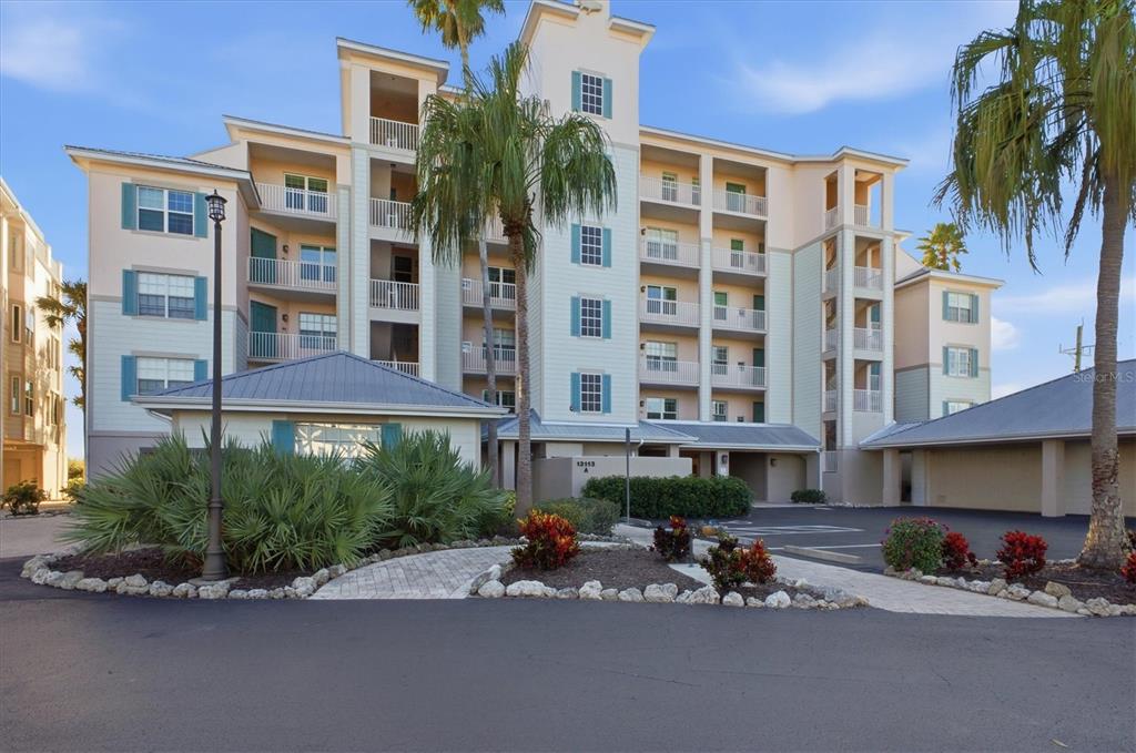 13113 Gasparilla Road, Unit 403 Placida, FL 33946 - Photo 52 of 62 a view of a building with a patio