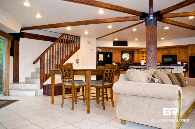 5751 Alabama Street Orange Beach, AL 36561 - Photo 10 of 25 Unique design with exposed beams and lots of natural light from windows and double sliding doors!