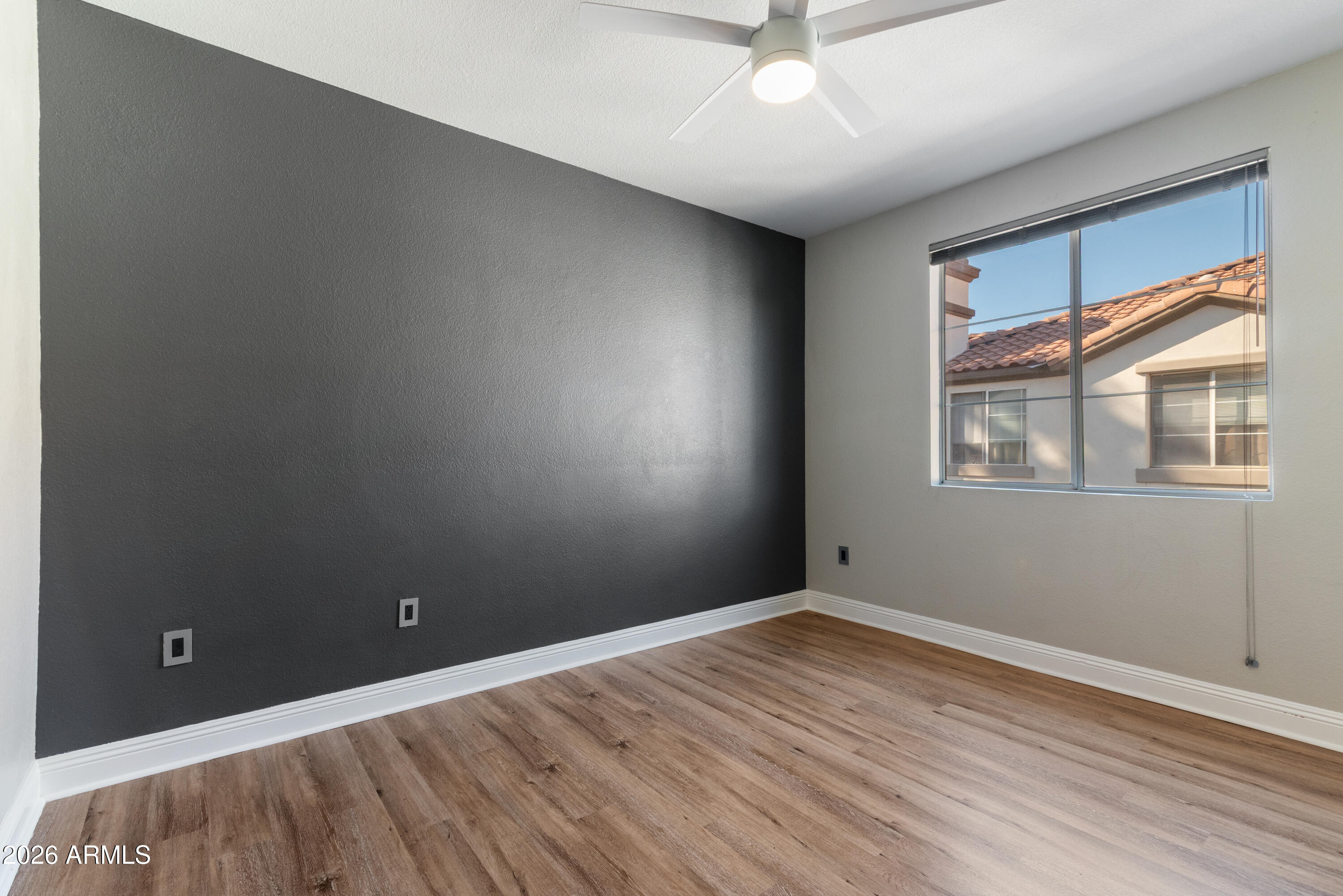 2992 North Miller Road, Unit A212 Scottsdale, AZ 85251 - Photo 10 of 25 Primary Bedroom with Accent Wall