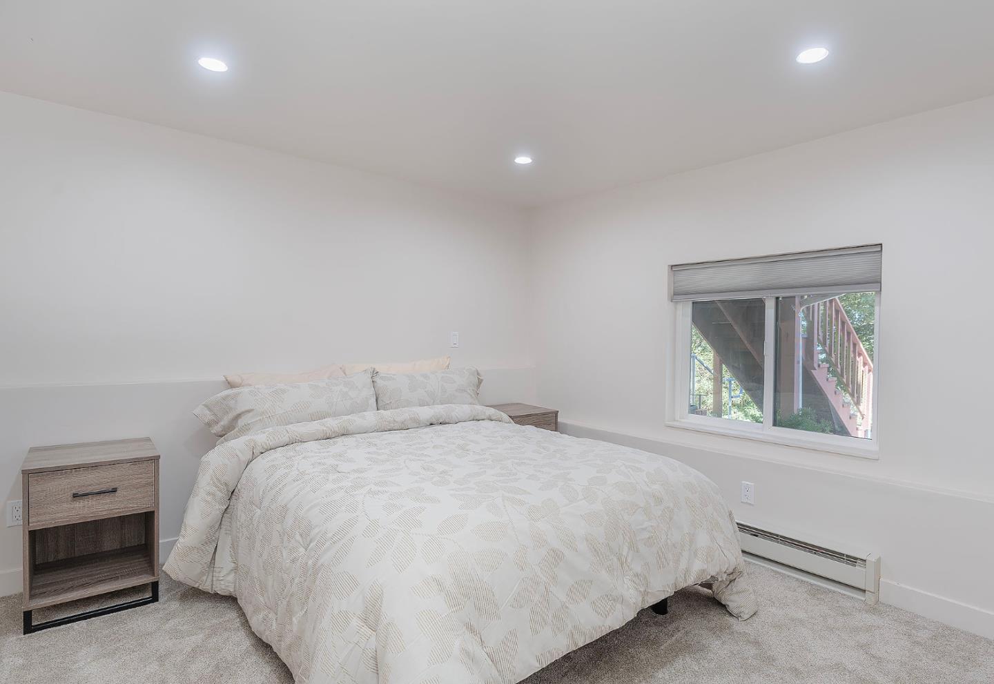 4113 Crest Road Pebble Beach, CA 93953 - Photo 11 of 15 a bed sitting in a bedroom next to a window