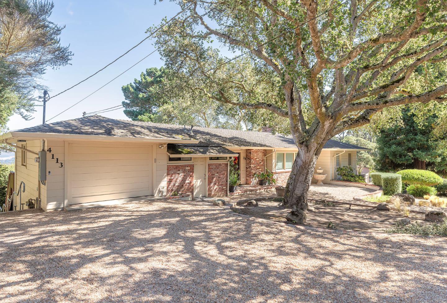 4113 Crest Road Pebble Beach, CA 93953 - Photo 14 of 15 a backyard of a house with yard and outdoor seating