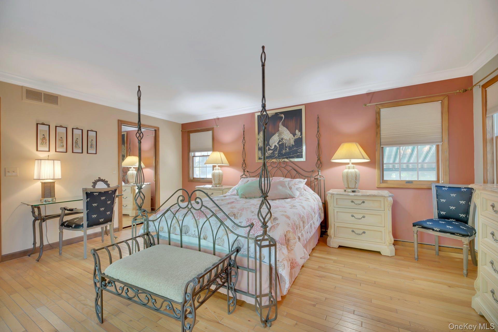 1075 Inlet Lane Greenport, NY 11944 - Photo 13 of 30 a bedroom with a bed and wooden floor