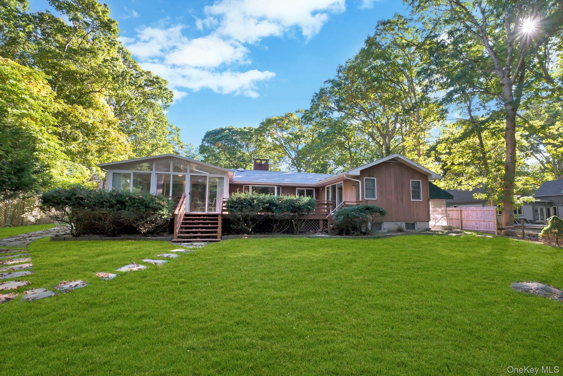 1075 Inlet Lane Greenport, NY 11944 - Photo 25 of 30 a view of a house with a yard