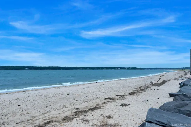 a view of a house with a yard and tree s