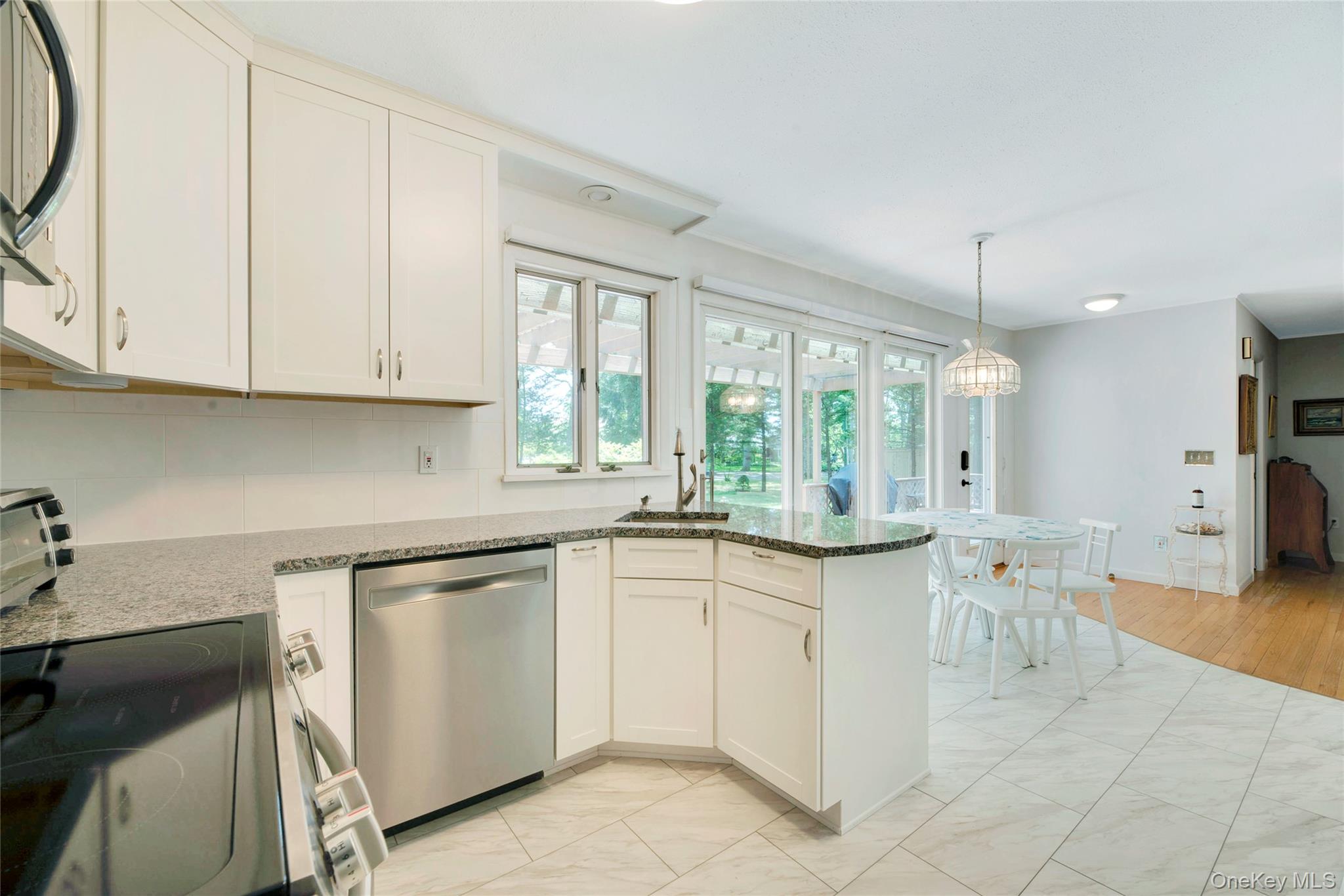 1075 Inlet Lane Greenport, NY 11944 - Photo 5 of 30 a kitchen with a sink and cabinets