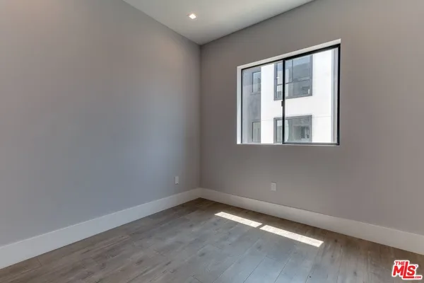 an empty room with closet area