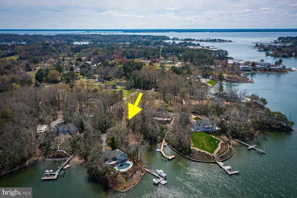 an aerial view of a house with a swimming pool yard and outdoor seating