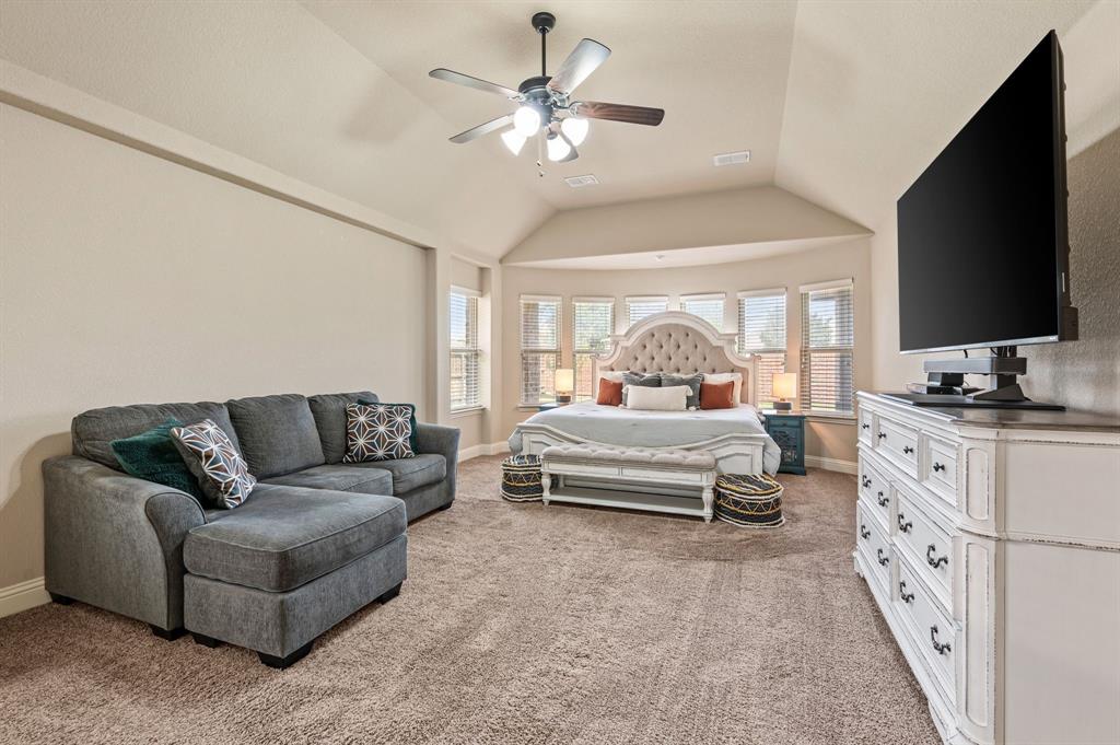 5209 Edgebrook Way Fort Worth, TX 76244 - Photo 15 of 33 a bedroom with furniture and a flat screen tv