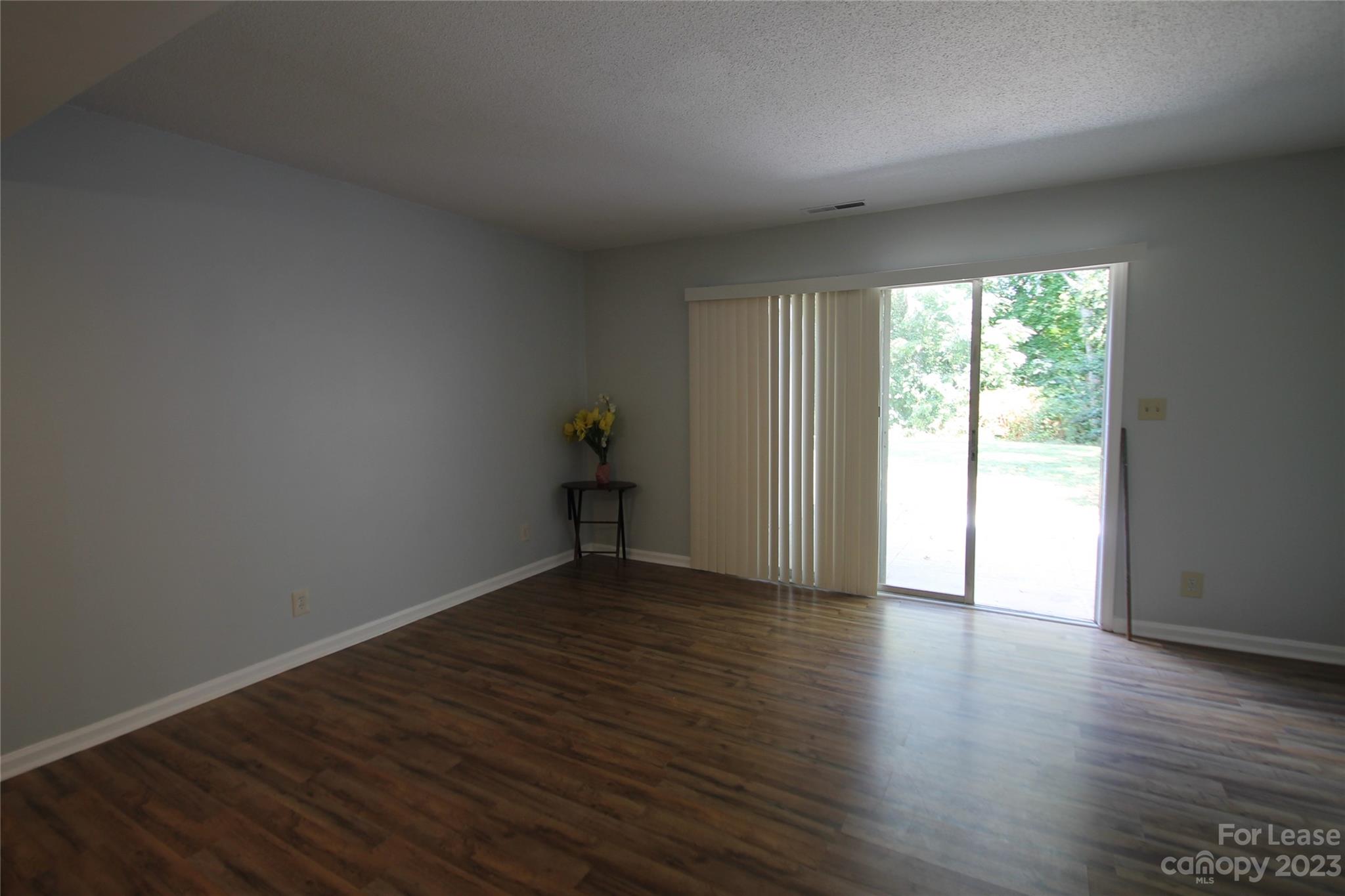 1788 Ebenezer Road Rock Hill, SC 29732 - Photo 12 of 30 a view of an empty room with wooden floor and a window