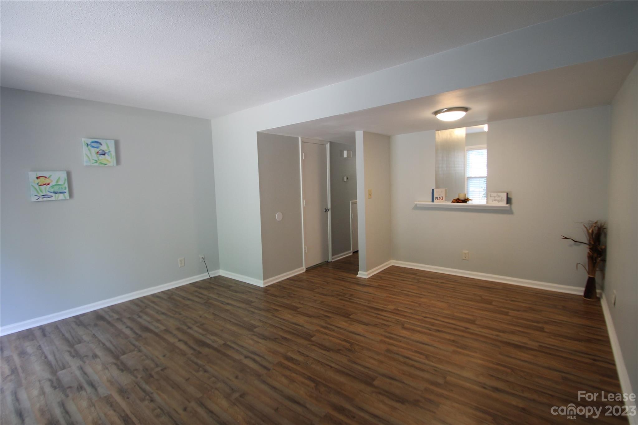 1788 Ebenezer Road Rock Hill, SC 29732 - Photo 13 of 30 a view of an empty room with wooden floor and a window