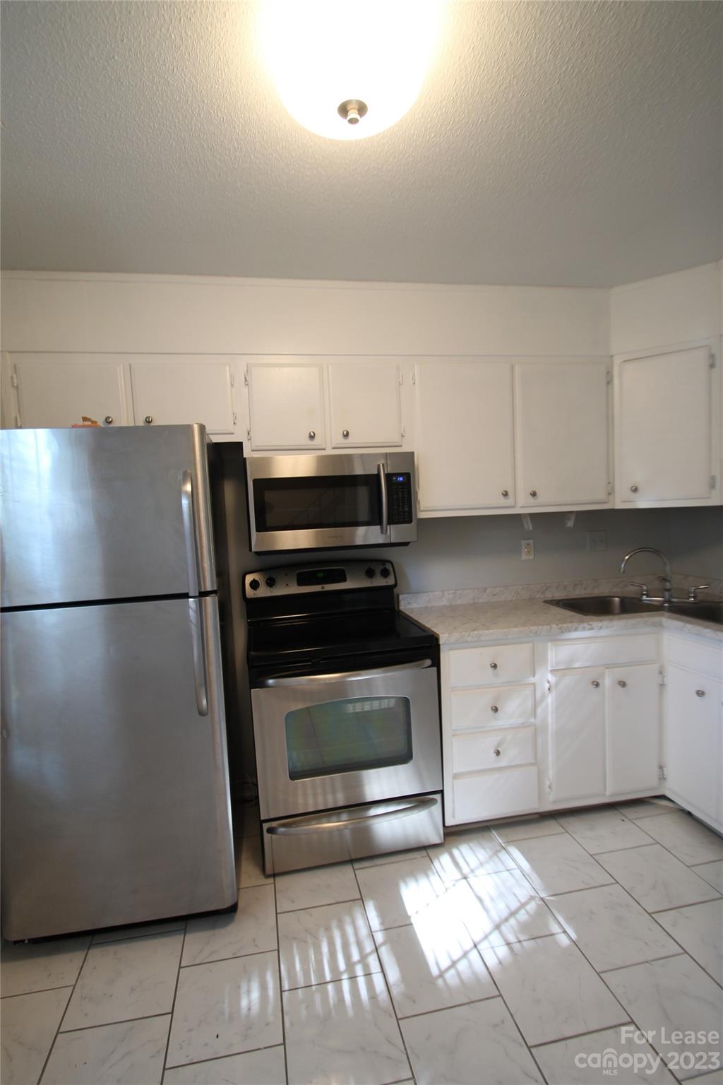 1788 Ebenezer Road Rock Hill, SC 29732 - Photo 2 of 30 a kitchen with appliances and cabinets