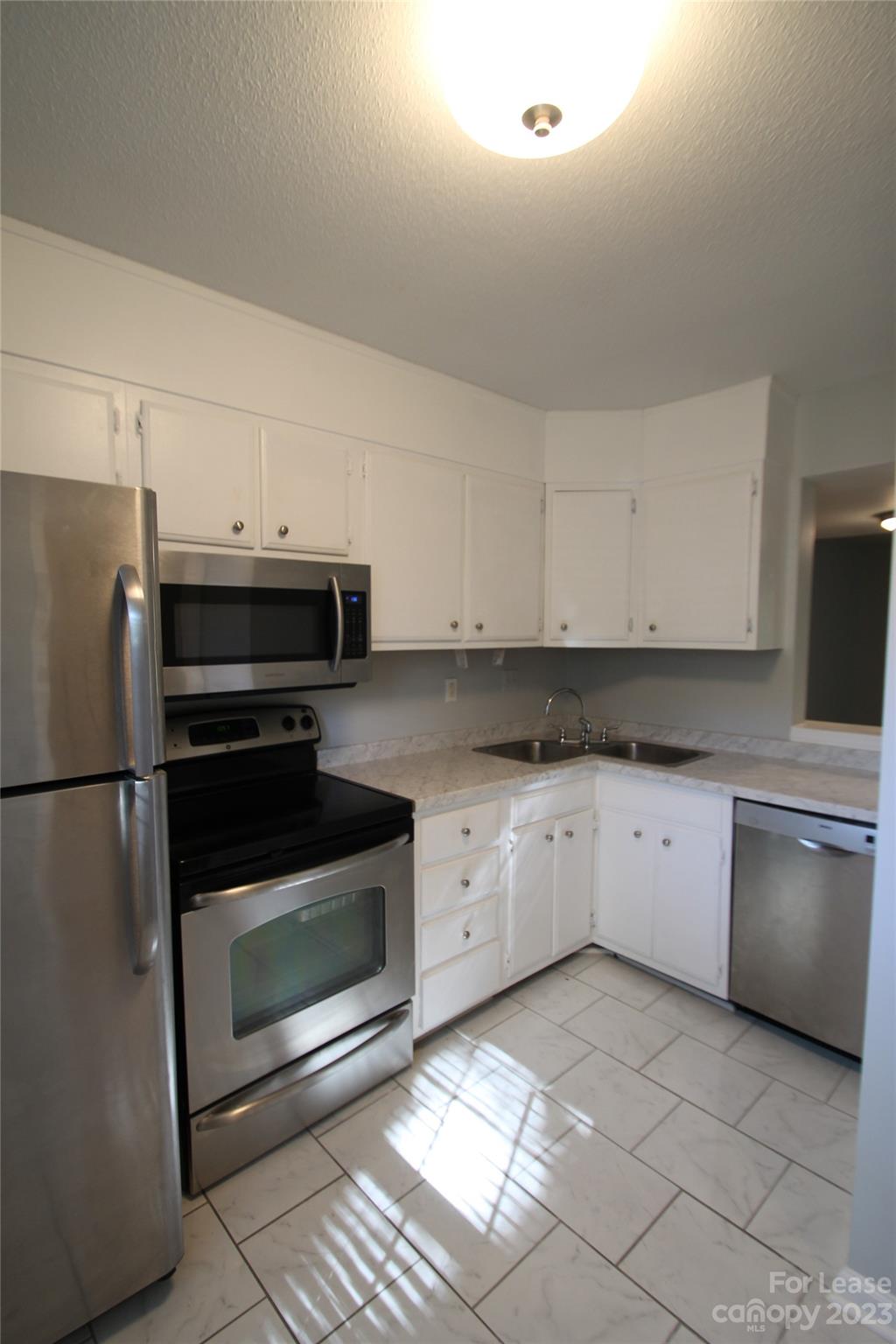 1788 Ebenezer Road Rock Hill, SC 29732 - Photo 3 of 30 a kitchen with granite countertop cabinets stainless steel appliances and a counter space