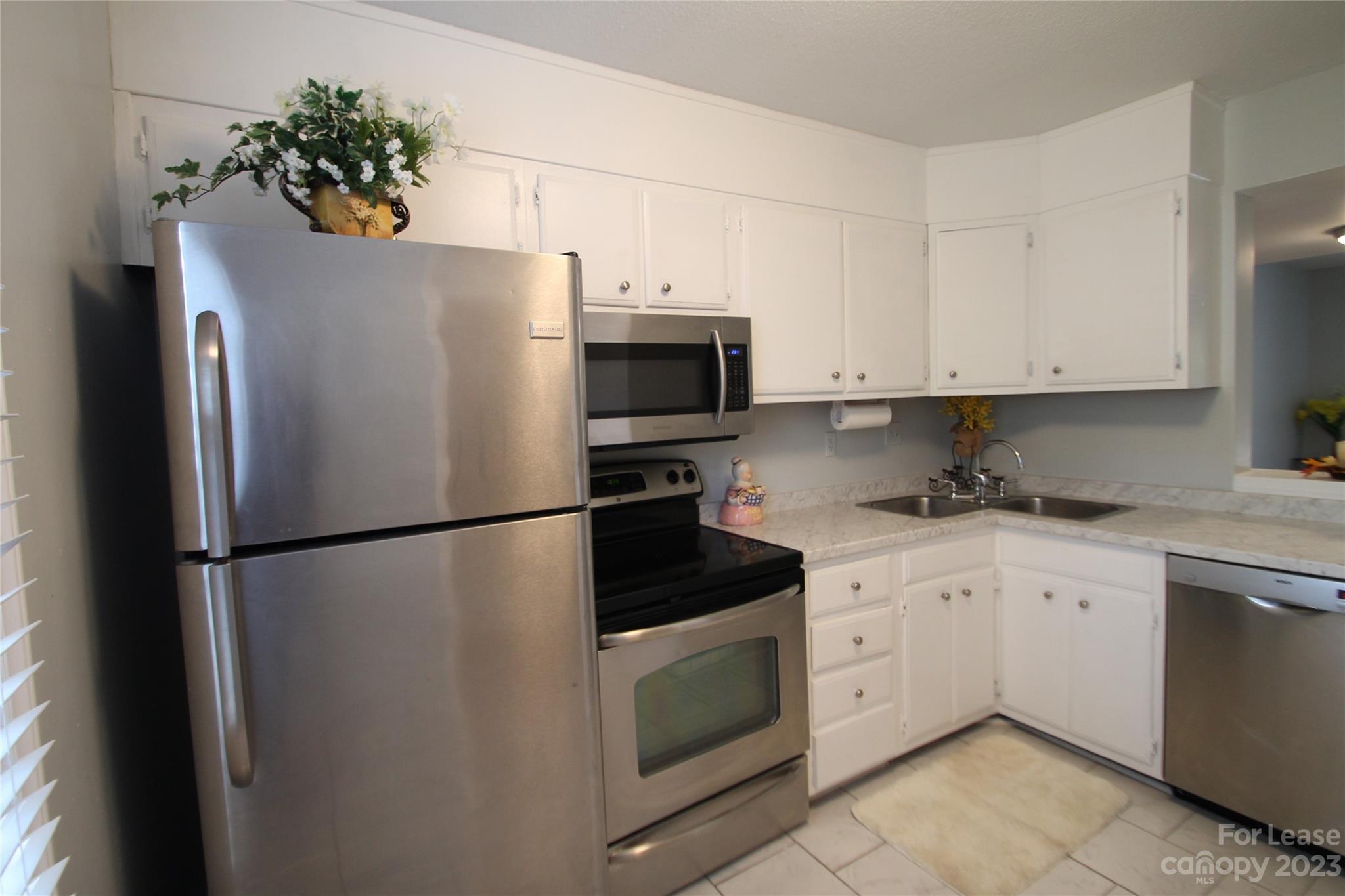 1788 Ebenezer Road Rock Hill, SC 29732 - Photo 4 of 30 a white refrigerator freezer sitting in a kitchen