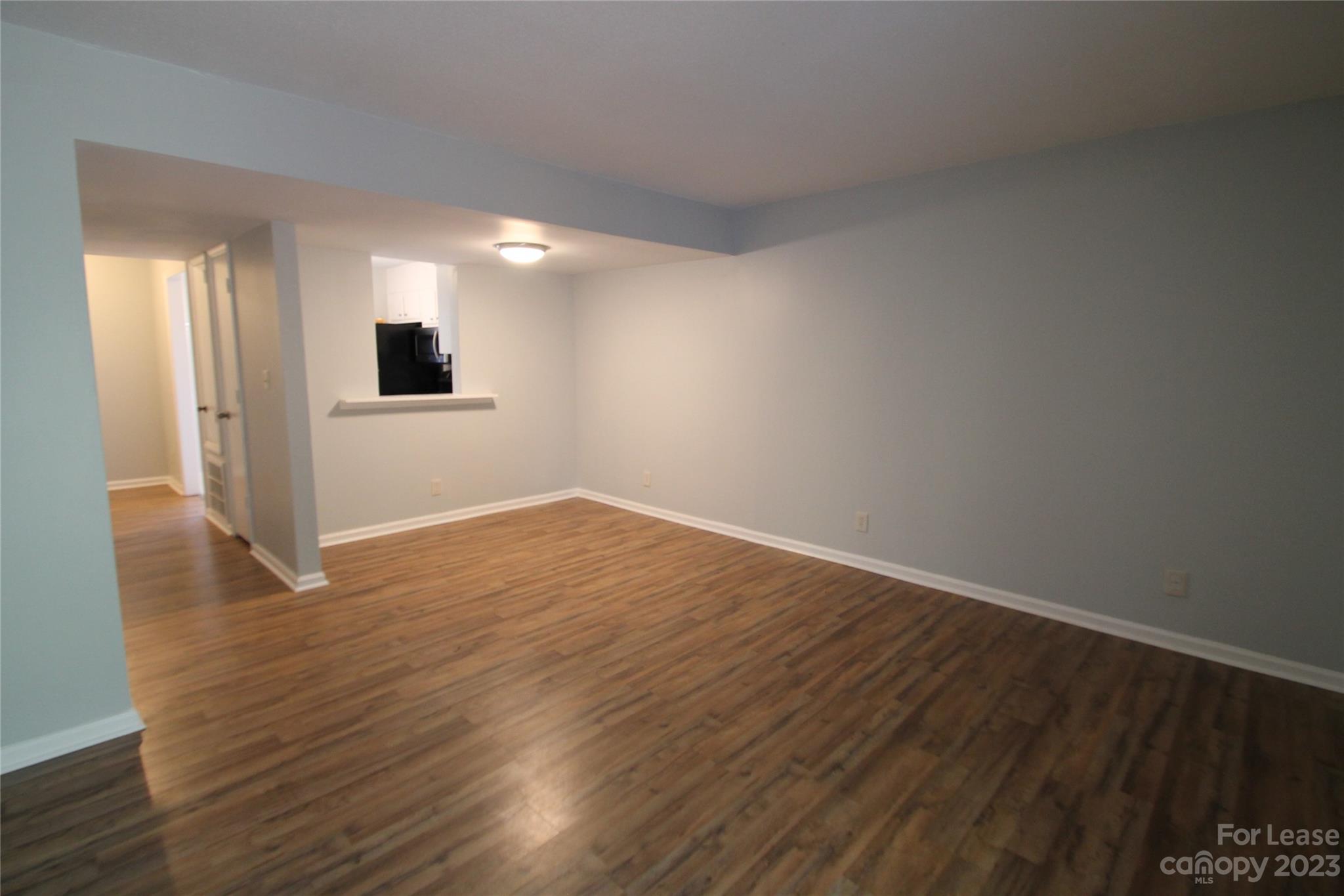 1788 Ebenezer Road Rock Hill, SC 29732 - Photo 10 of 30 a view of an empty room with wooden floor and a window