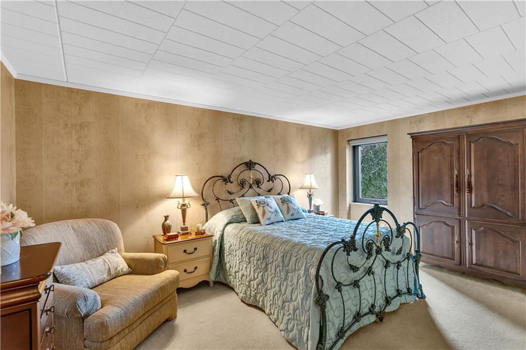 900 Washington Road, Unit 412 Pittsburgh, PA 15228 - Photo 18 of 34 a bed room with a bed and a balcony