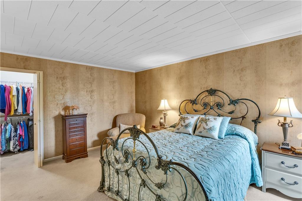 900 Washington Road, Unit 412 Pittsburgh, PA 15228 - Photo 19 of 34 a bedroom with a bed and a closet