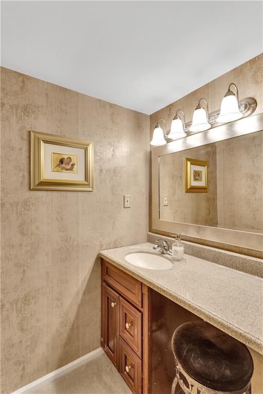 900 Washington Road, Unit 412 Pittsburgh, PA 15228 - Photo 20 of 34 a bathroom with a sink and a mirror