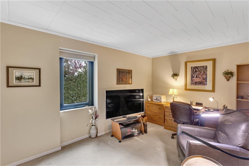 900 Washington Road, Unit 412 Pittsburgh, PA 15228 - Photo 23 of 34 a living room with furniture and a fireplace