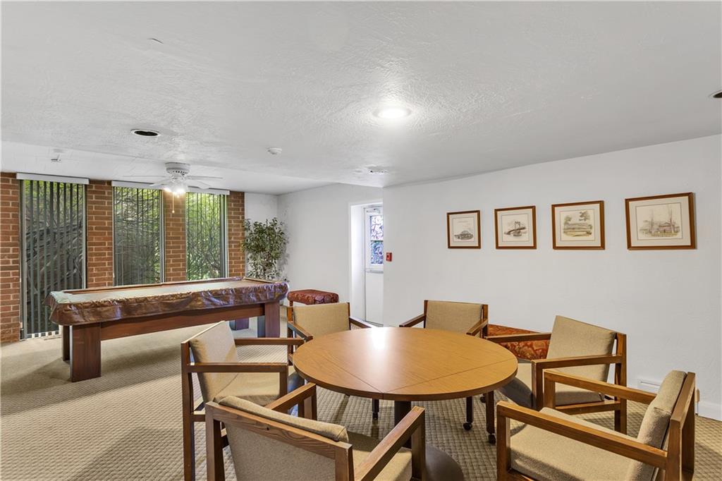 900 Washington Road, Unit 412 Pittsburgh, PA 15228 - Photo 30 of 34 a dining room with furniture and a floor to ceiling window