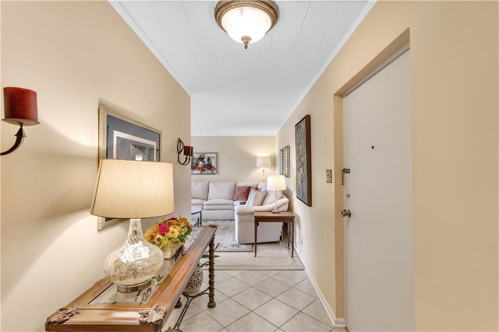 900 Washington Road, Unit 412 Pittsburgh, PA 15228 - Photo 5 of 34 a living room with furniture and a flat screen tv