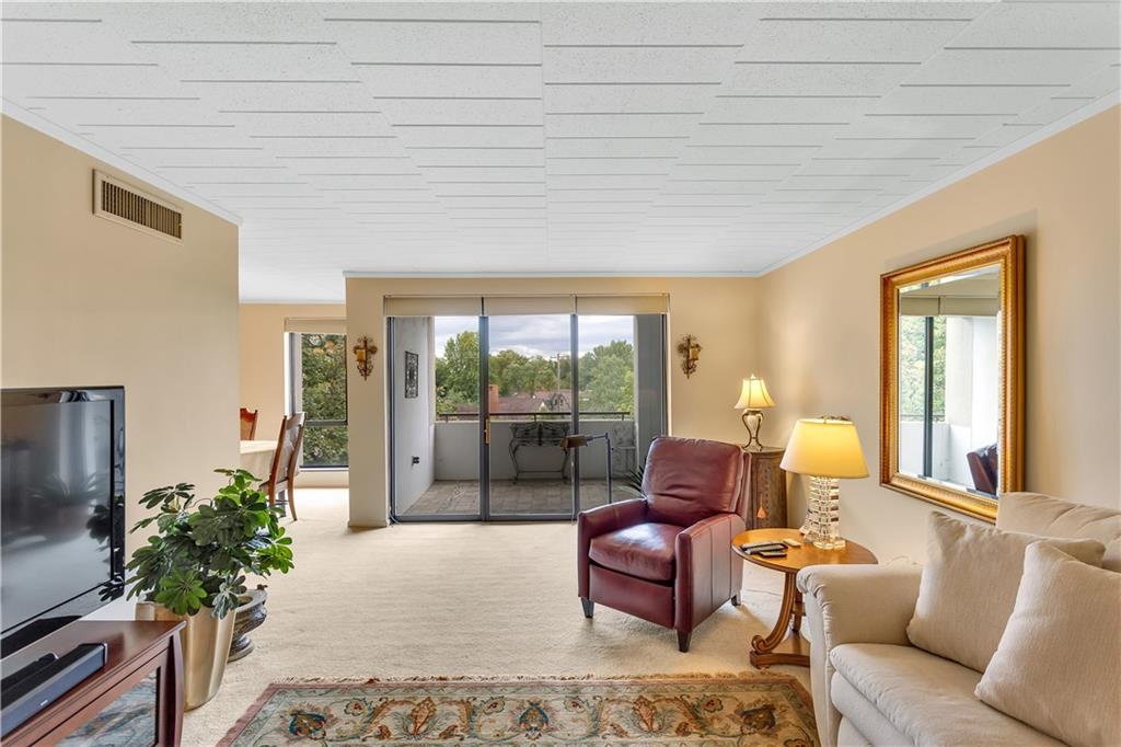 900 Washington Road, Unit 412 Pittsburgh, PA 15228 - Photo 7 of 34 a living room with furniture and a floor to ceiling window