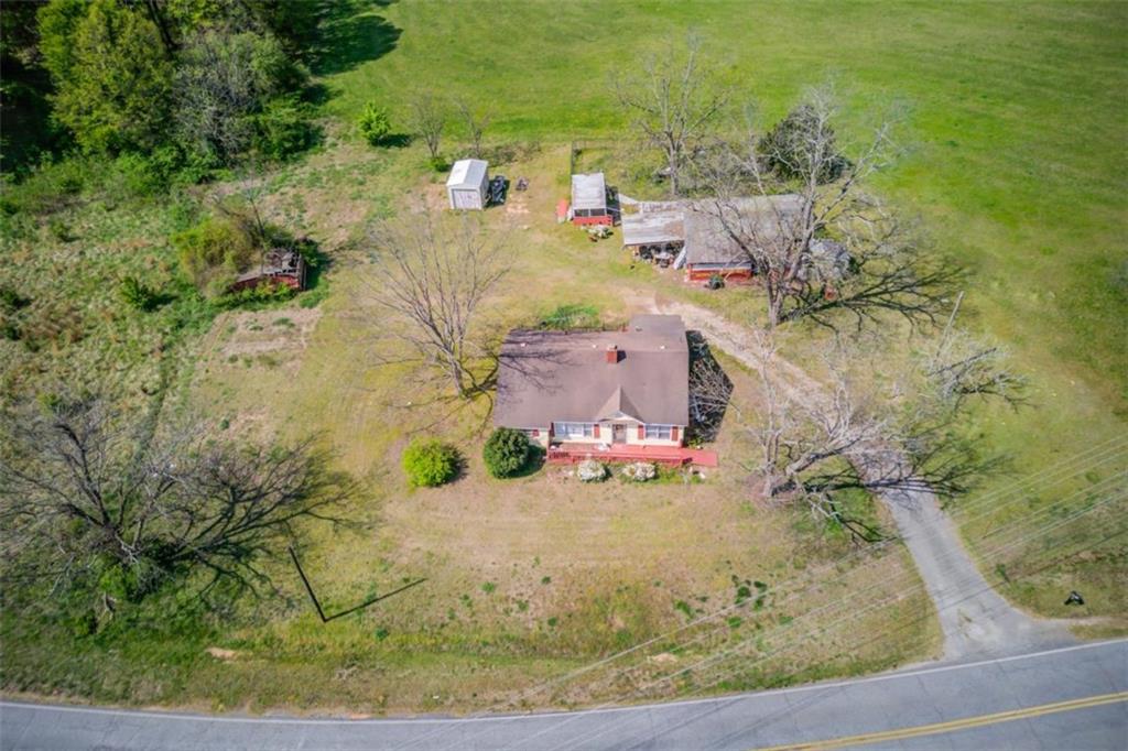 an aerial view of a house with a yard