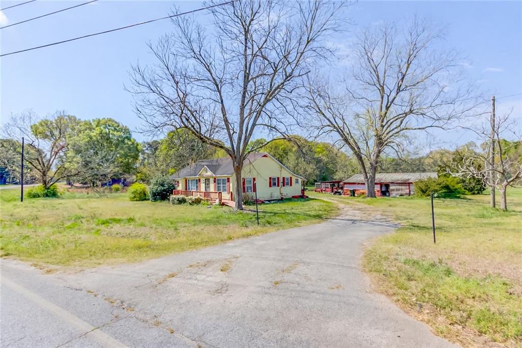 1023 Poplar Street Monroe, GA 30655 - Photo 12 of 25 a view of road with large trees