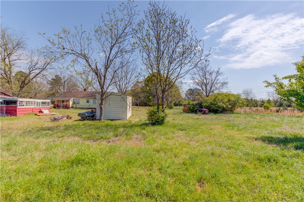1023 Poplar Street Monroe, GA 30655 - Photo 15 of 25 a view of backyard with green space