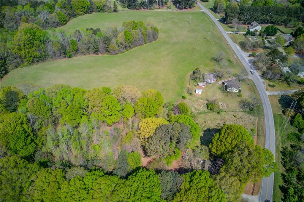 1023 Poplar Street Monroe, GA 30655 - Photo 5 of 25 a view of a garden with a building