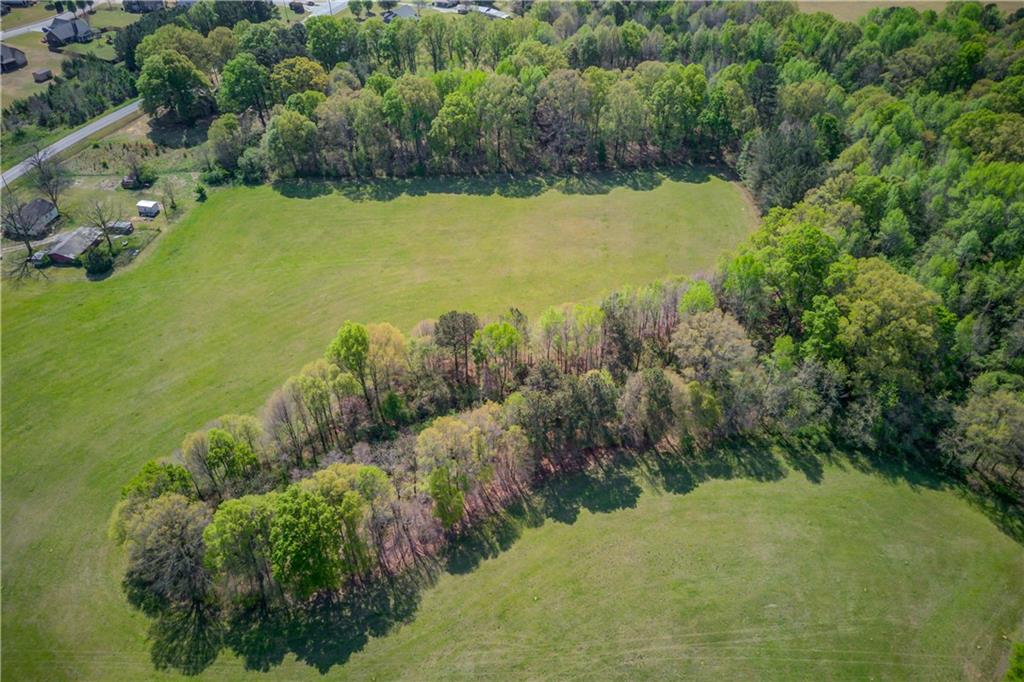 1023 Poplar Street Monroe, GA 30655 - Photo 8 of 25 a view of a lake with houses in the back