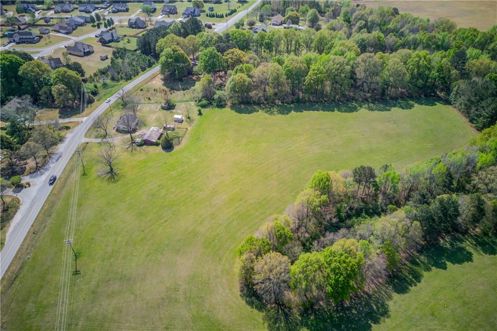 1023 Poplar Street Monroe, GA 30655 - Photo 9 of 25 a view of a lake with a houses