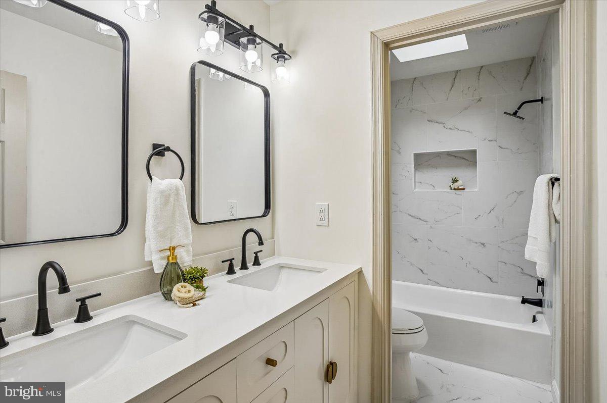 6300 Hickory Bend Road Brandywine, MD 20613 - Photo 21 of 33 Elegant dual-sink bathroom retreat.