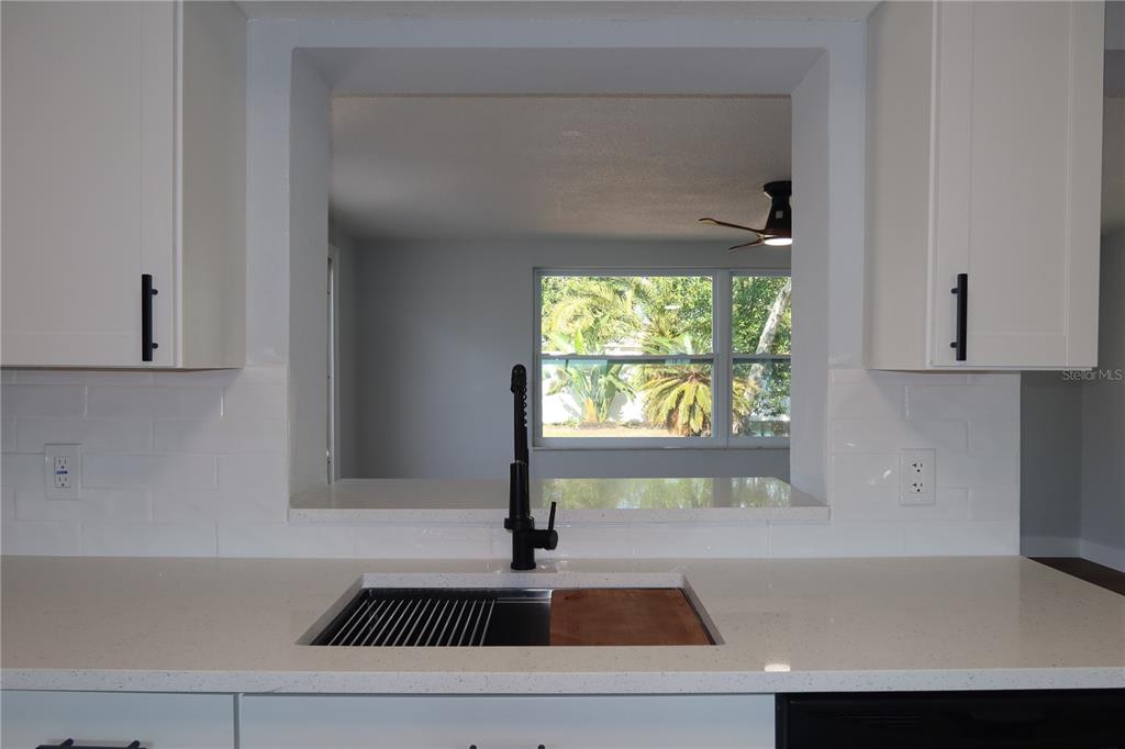 7521 Coventry Drive Port Richey, FL 34668 - Photo 13 of 45 a kitchen with a sink and a window