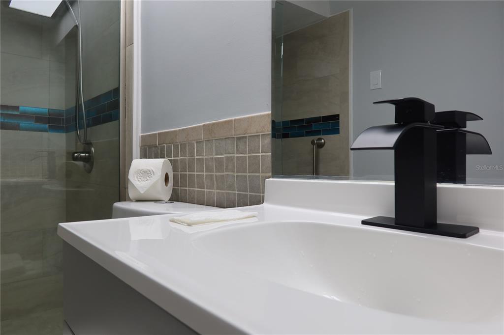 7521 Coventry Drive Port Richey, FL 34668 - Photo 20 of 45 a bathroom with a sink and a shower