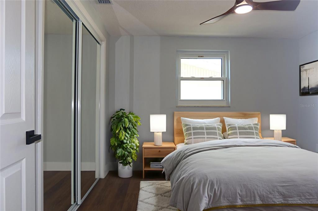 7521 Coventry Drive Port Richey, FL 34668 - Photo 21 of 45 a bedroom with a bed and a window