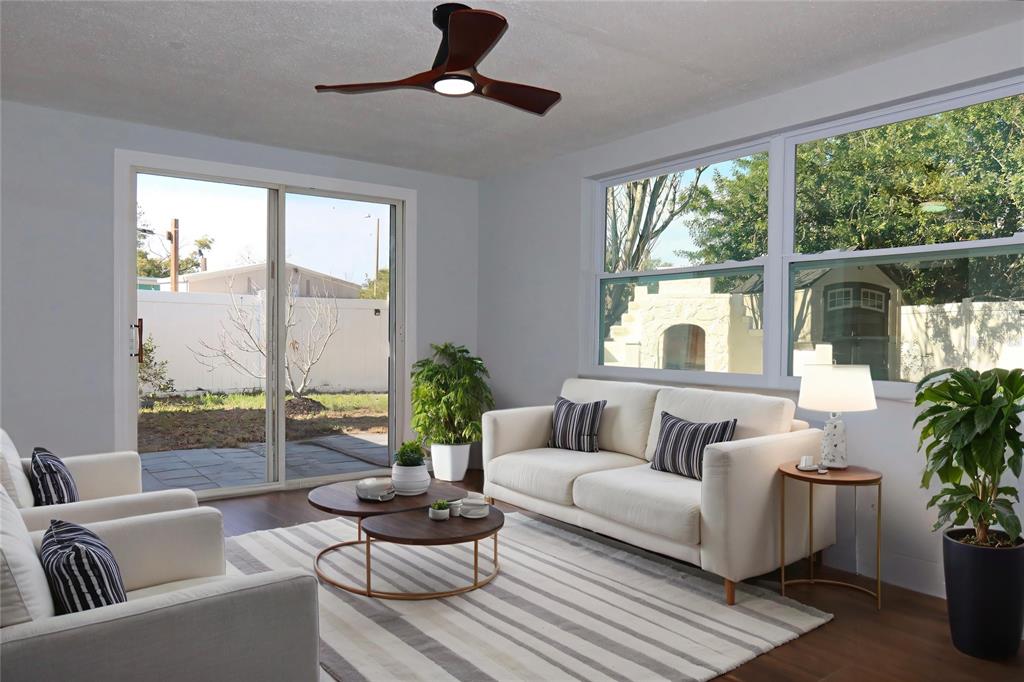 7521 Coventry Drive Port Richey, FL 34668 - Photo 27 of 45 a living room with furniture and a large window