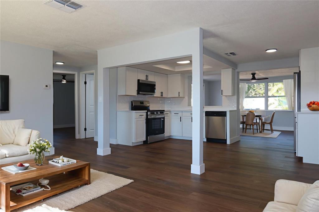 7521 Coventry Drive Port Richey, FL 34668 - Photo 3 of 45 a living room with furniture and a wooden floor