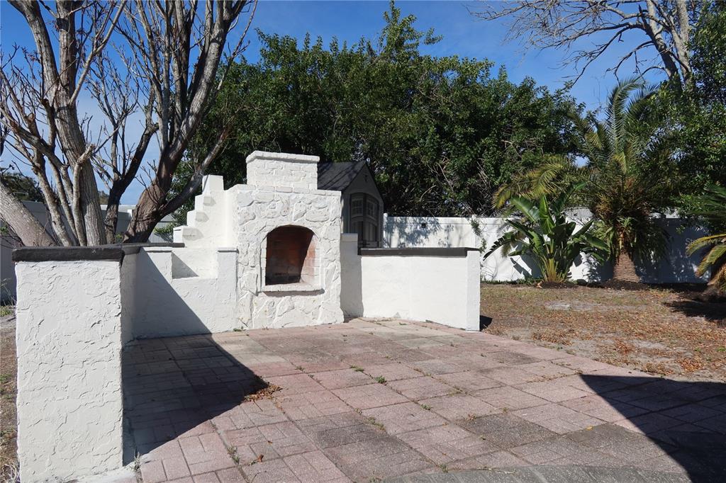 7521 Coventry Drive Port Richey, FL 34668 - Photo 34 of 45 a view of a white house with a yard