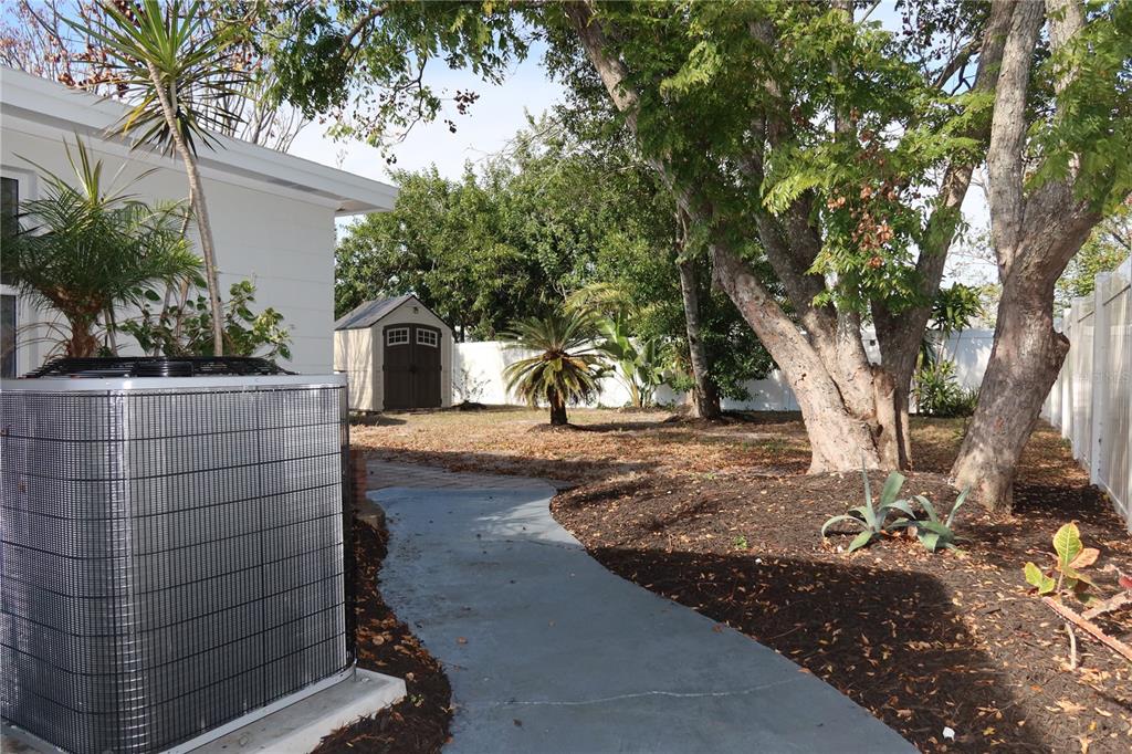 7521 Coventry Drive Port Richey, FL 34668 - Photo 35 of 45 a view of a yard with plants and trees