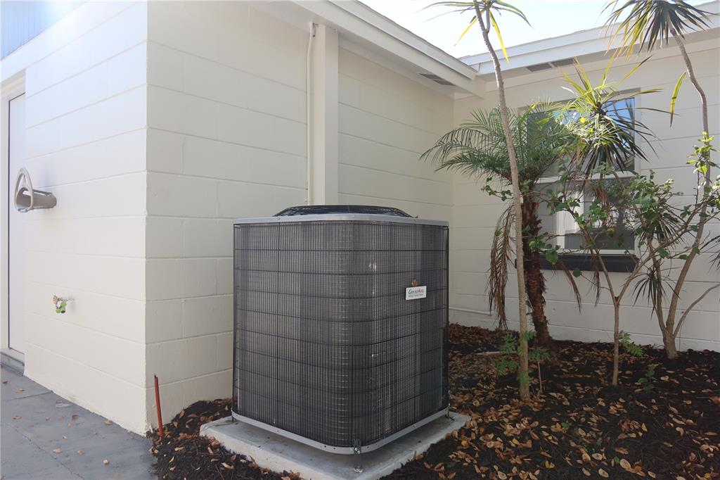 7521 Coventry Drive Port Richey, FL 34668 - Photo 36 of 45 a vase of flowers sitting on a floor