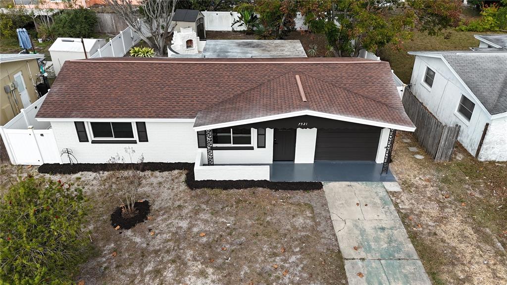 7521 Coventry Drive Port Richey, FL 34668 - Photo 42 of 45 a aerial view of a house with a yard
