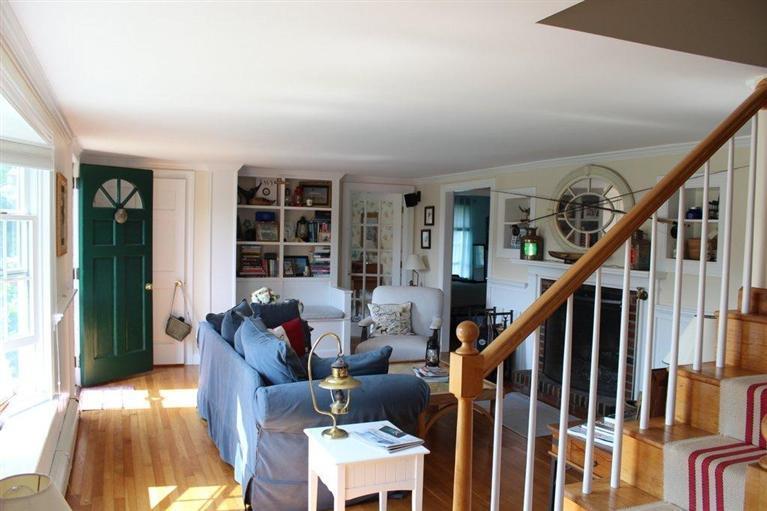 39 Pine Grove Road Chatham, MA 02633 - Photo 11 of 34 a living room with furniture and stairs