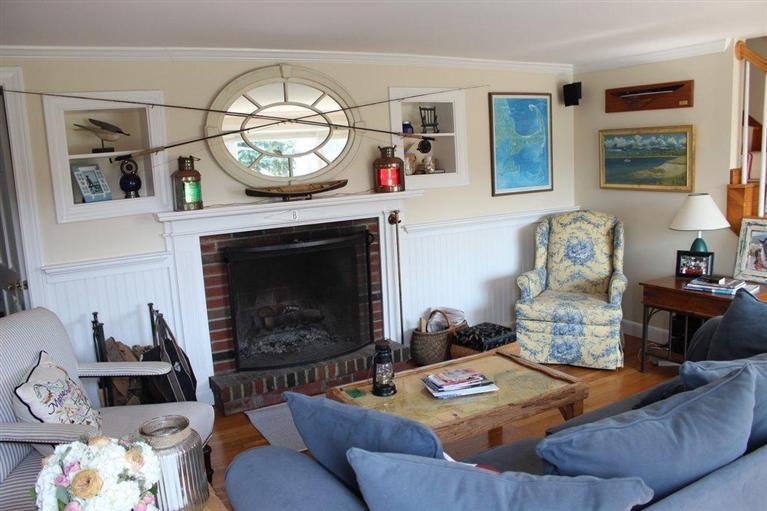 39 Pine Grove Road Chatham, MA 02633 - Photo 17 of 34 a living room with furniture and a fireplace