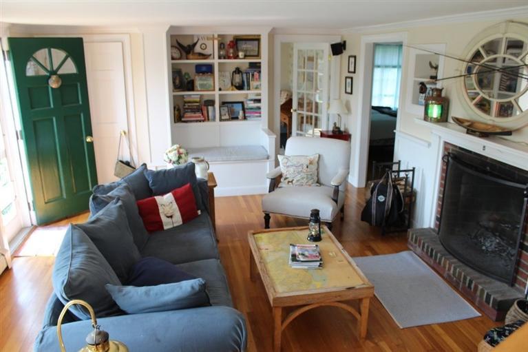 39 Pine Grove Road Chatham, MA 02633 - Photo 18 of 34 a living room with furniture and a fireplace