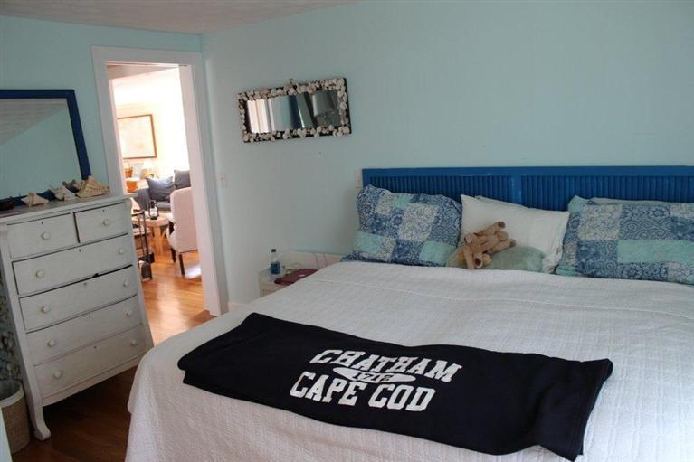 39 Pine Grove Road Chatham, MA 02633 - Photo 21 of 34 a view of a bedroom with furniture and wooden floor