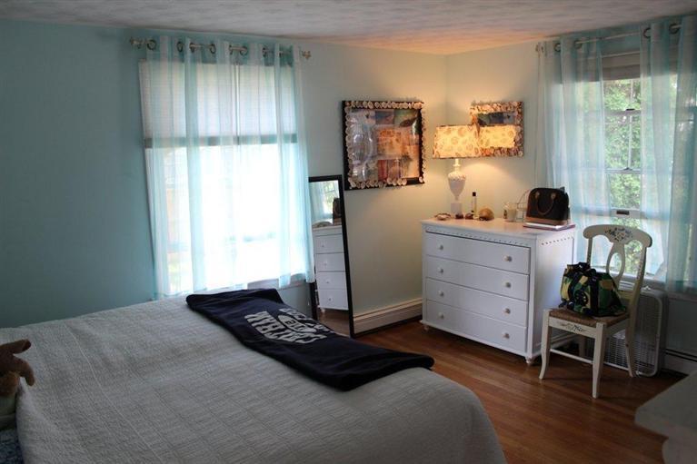 39 Pine Grove Road Chatham, MA 02633 - Photo 22 of 34 a bedroom with a bed and a window