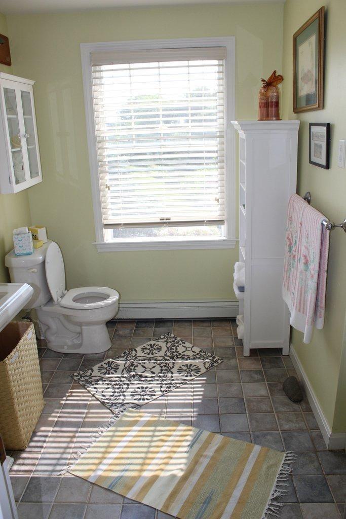 39 Pine Grove Road Chatham, MA 02633 - Photo 23 of 34 a bathroom with a toilet a sink and a window