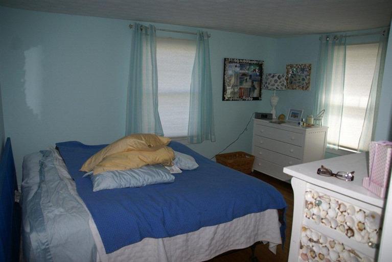 39 Pine Grove Road Chatham, MA 02633 - Photo 26 of 34 a bedroom with a bed and furniture